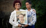 Sally-Rose and her mother Dulceta Cyrille, holding a picture of their late sister and daughter Sonia, who had a DNAR order placed on her