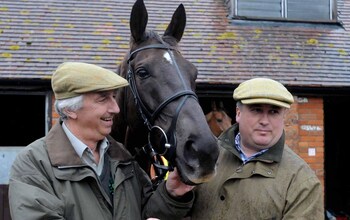 Paul Barber, left, with trainer Paul Nicholls and the Cheltenham Gold Cup-winner Denman, at Barber's stables in Ditcheat, Somerset