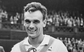 Vic Seixas holding the men's singles trophy after beating Kurt Nielsen in the Wimbledon final in 1953