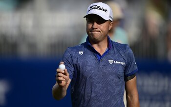 Justin Thomas of the United States waves to the fans on the 18th green during the second round of the Wyndham Championship at Sedgefield Country Club on August 04, 2023 in Greensboro, North Carolina