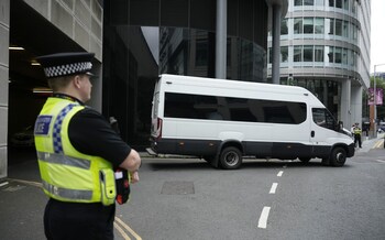 A police van leaves Manchester Crown Court
