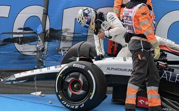 Daniel Ricciardo of Australia and Scuderia Alpha Tauri gets out of his car after crashing during Free Practice 2 during practice ahead of the F1 Grand Prix of The Netherlands at Circuit Park Zandvoort on August 25, 2023