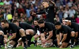 Aaron Smith of New Zealand leads the Haka with teammates