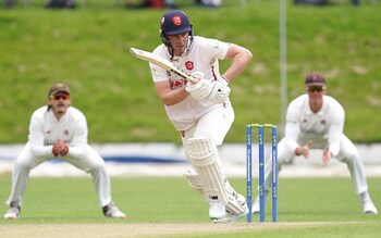 Dan Lawrence works the ball into the legside against the bowling of Lancashire's Will Williams