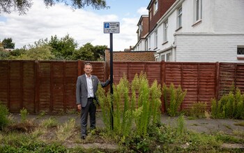 Local Conservative councillor Ivan Lyons observes the weeds in Brighton and Hove